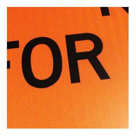 Orange Black Text on Reflective Image