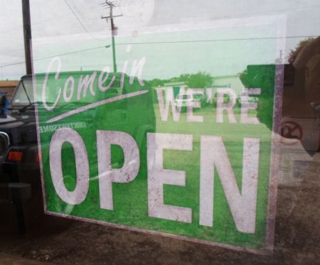 Weathered sign in tinted window